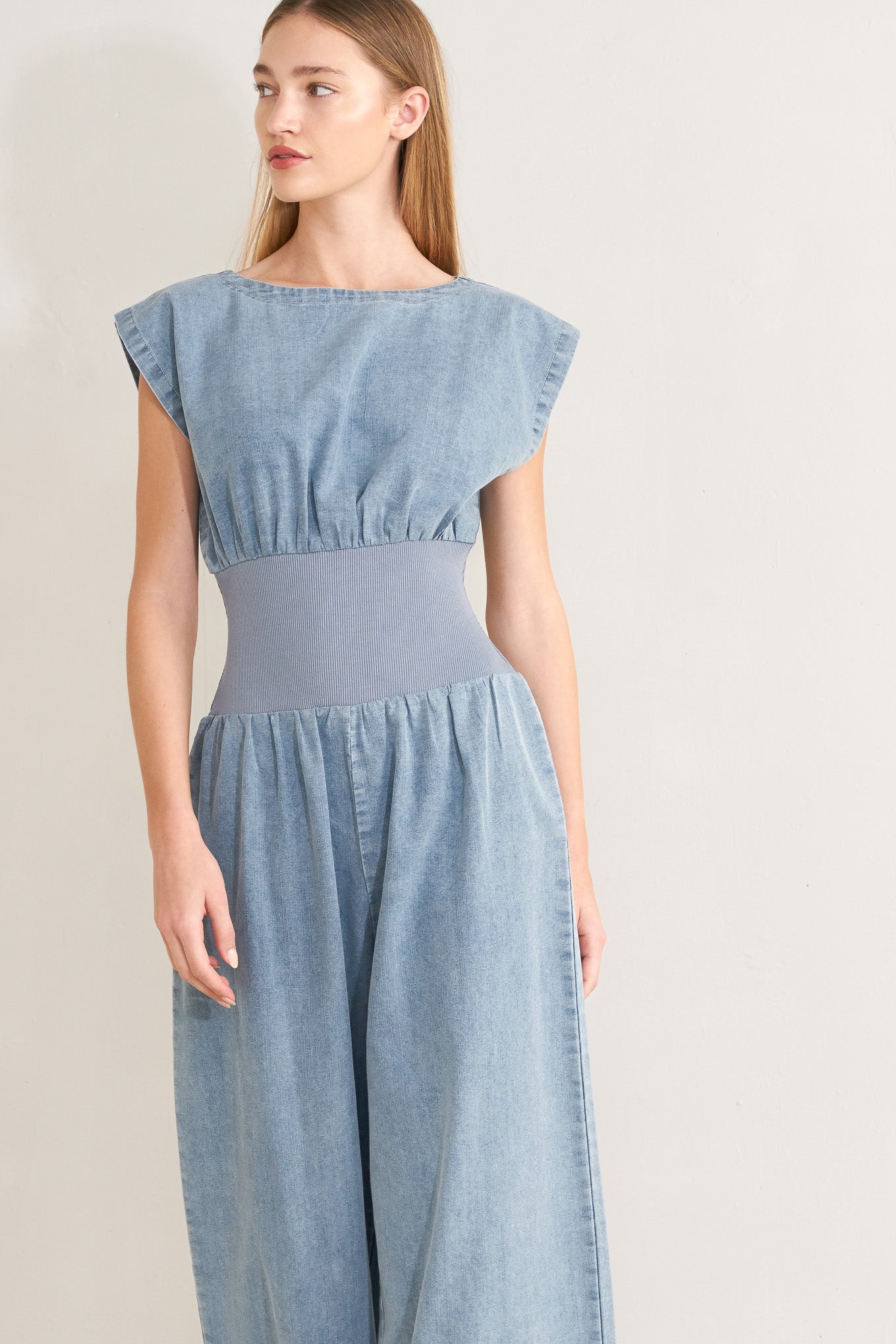 RUNNING IN DENIM JUMPSUIT