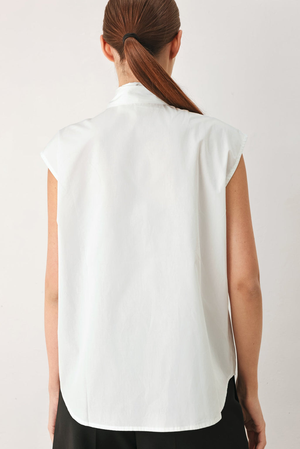 MODERN STATEMENT BOW WOVEN TOP
