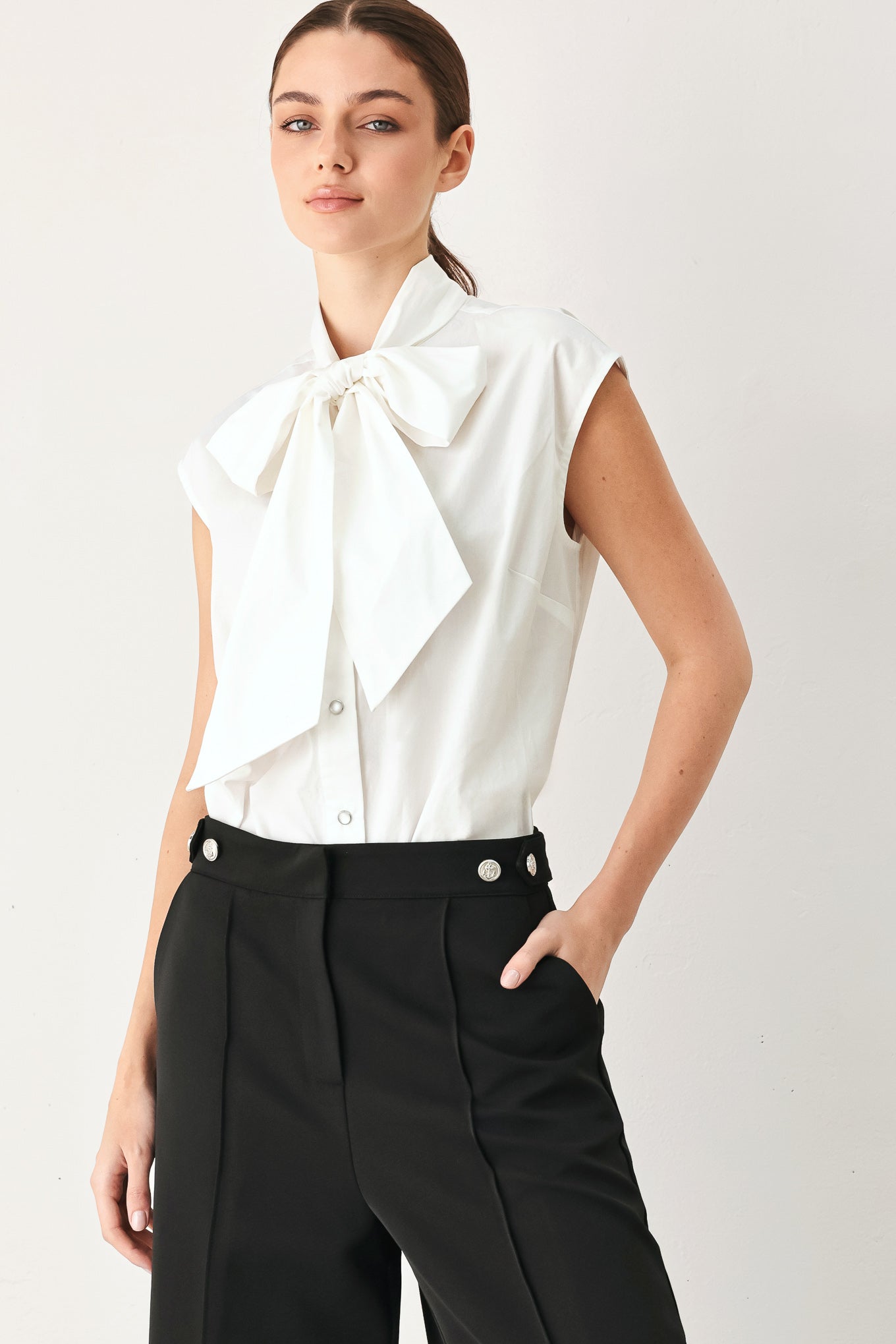 MODERN STATEMENT BOW WOVEN TOP